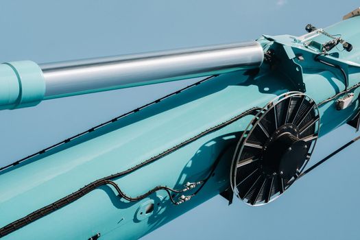 Hydraulic cylinder of the lifting system on a car crane.The control system of the crane engine.Lifting the hydraulic compartment on a truck crane