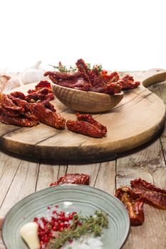 Close up of Mediterranean dried tomatoes on cutting board