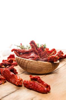 Close up of Mediterranean dried tomatoes on cutting board