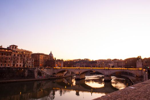 View of Vittorio Emanuele II bridge at sunset in Rome