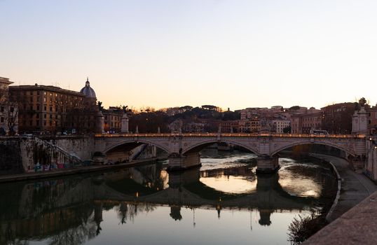 View of Vittorio Emanuele II bridge at sunset in Rome