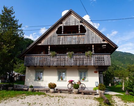 View of Slovenian chalet in Stara Fuzina little town near Bohinj, Slovenia