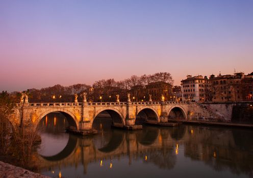 View of Aelian Bridge or Pons Aelius in italian called Ponte Sant'Angelo at sunset in Rome