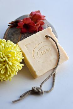 View of Natural soap, sponge and red flower