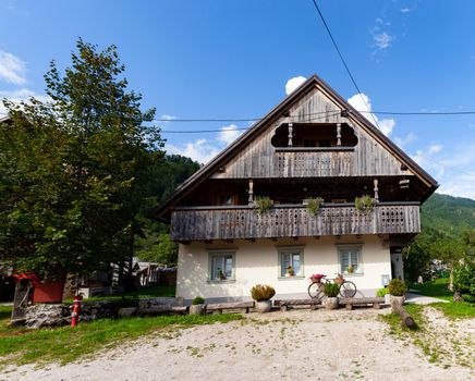 View of Slovenian chalet in Stara Fuzina little town near Bohinj, Slovenia