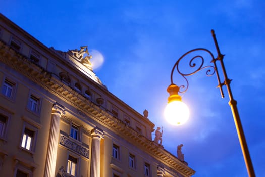 Evening view of a historic building in Trieste, Italy