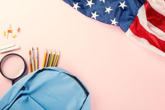 Back to school or college concept. Top view of school supplies stationery and American flag, studio shot isolated on pink background, Back to education new normal during outbreak of coronavirus