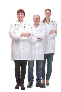 Team of doctors standing arms crossed and smiling at camera. Concept of medical help and confidence