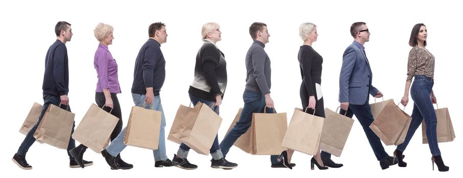 a group of people stand in line with shopping bags. isolated on white