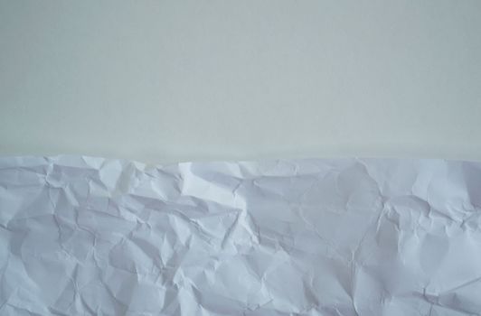 Texture, background. White crumpled paper, close up.