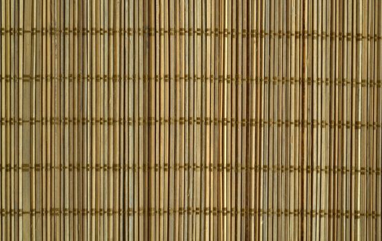 Texture, background, sushi mat. Bamboo sushi mat close-up.