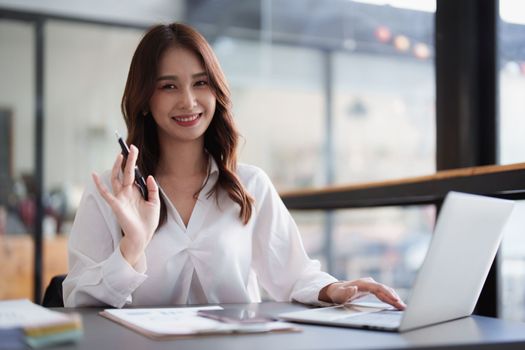 Portrait of business accountant using laptop for analyze financial data. finance, tax, accounting concept.