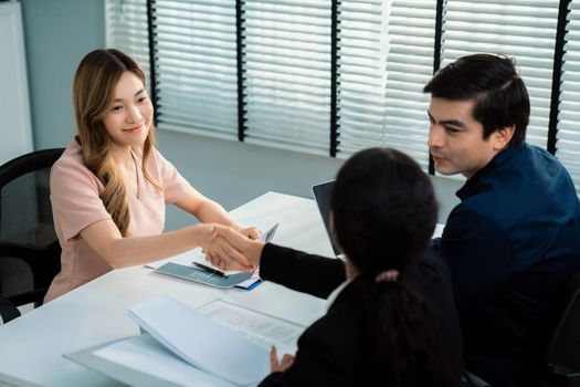 A new and competent female employee successfully interviewed. Newly graduated gets her first job after the interview.