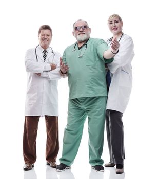 in full growth. successful female doctor standing in front of her colleagues . isolated on a white