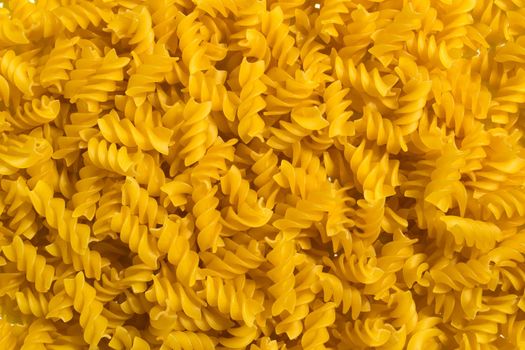 
Background, texture, spiral pasta. Spiral pasta close-up.