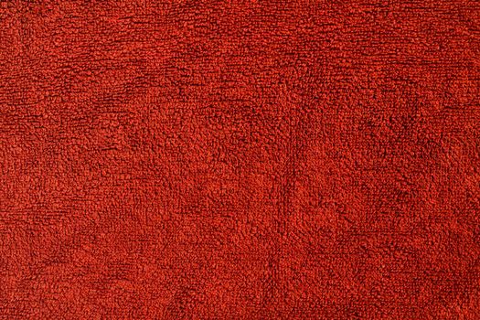 
Background, texture, red towel, fabric. Close-up photo of a red towel.