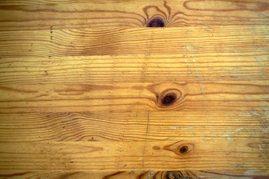 
Background, texture, scratched old wooden table. The wooden surface is old with scratches.