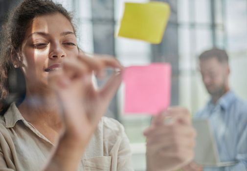 Bringing her vision to life. Shot of a confident businesswoman presenting an idea to her colleague