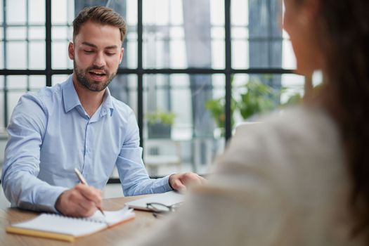 Handsome bearded man in a modern office