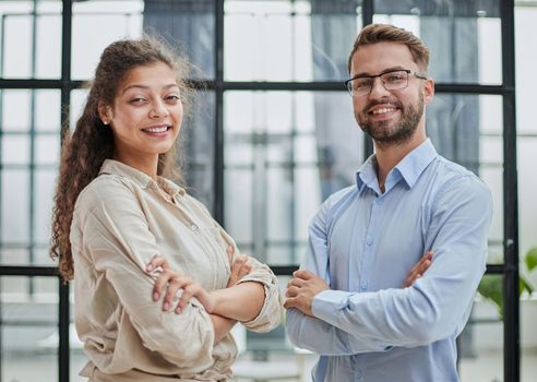 business people in the office arms crossed