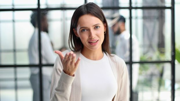 Face of beautiful woman on the background of business people