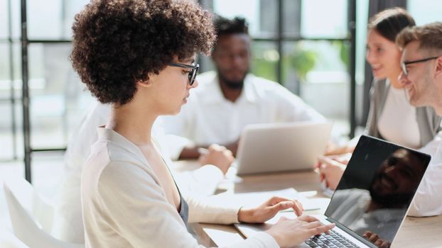 Face of beautiful woman on the background of business people