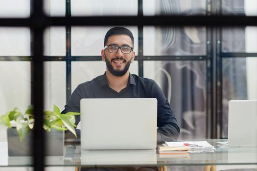 Businessman working on a laptop computer in the office