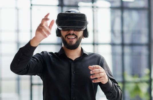 Businessman with virtual reality headset at office