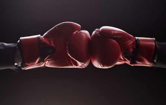 Two men's hands in boxing gloves. Confrontation concept