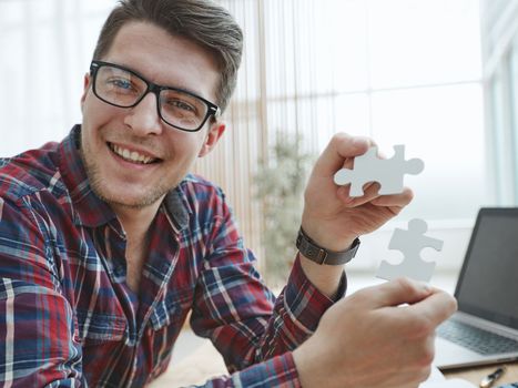 Businessman hands connecting jigsaw puzzle. Business solutions, success and strategy