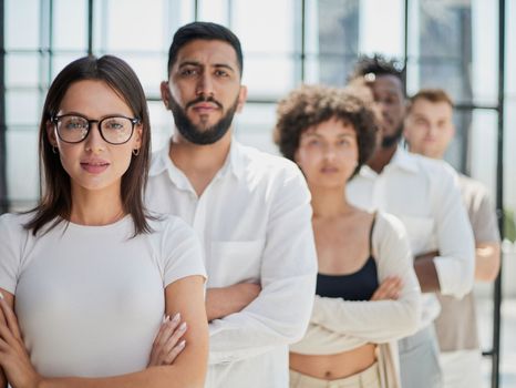 Face of beautiful woman on the background of business people