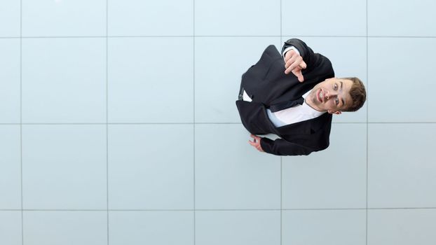 businessman with arms up celebrating his victory