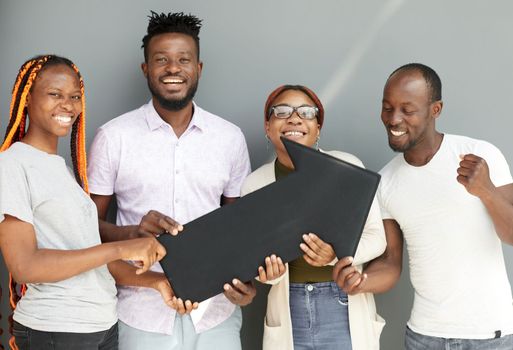 Business Team Holding black arrow together