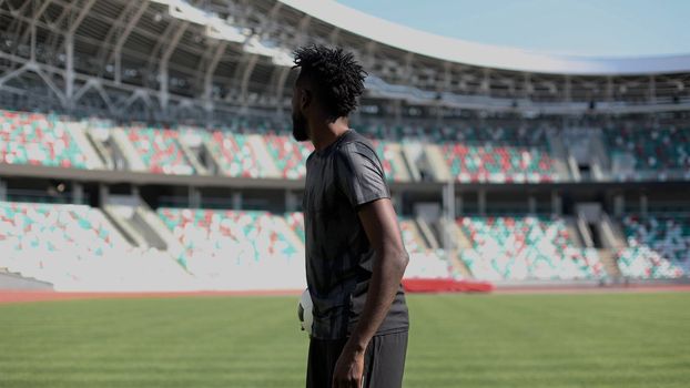 African American soccer player during match inside large stadium