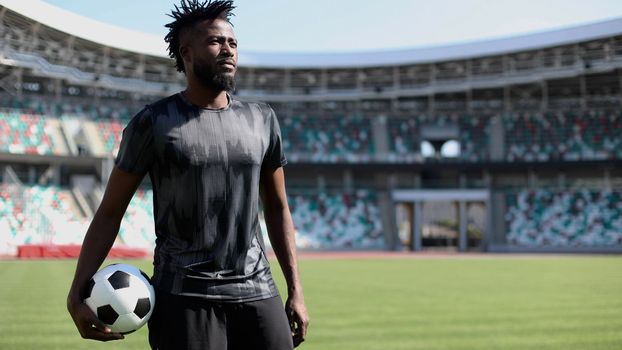 African American soccer player during match inside large stadium