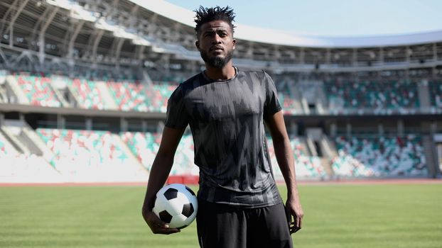 African American soccer player during match inside large stadium