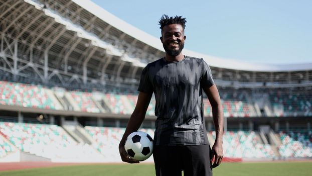 African American soccer player during match inside large stadium