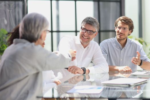 discussion of business people in the office sitting at the table