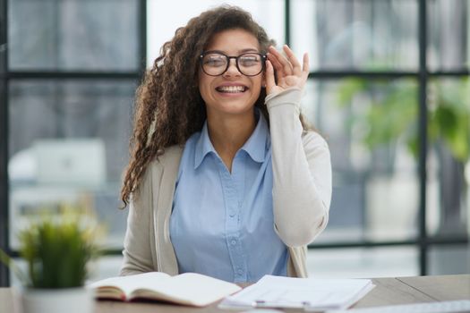 Focused agent girl, lawyer manager, sitting at workplace, working in office