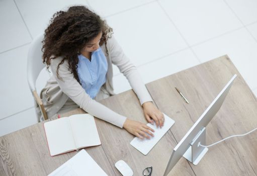 Portrait beautiful business woman working in office use computer with copy space