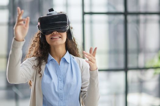 Girl trying to touch objects in virtual reality.