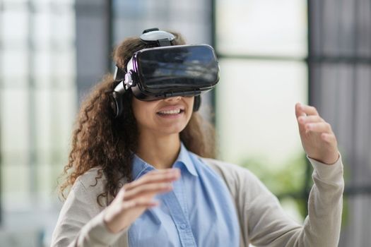 Girl trying to touch objects in virtual reality.