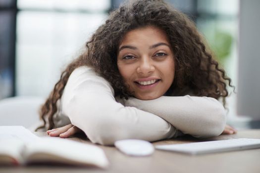 Portrait of a beautiful business woman sleeping on the table in the office