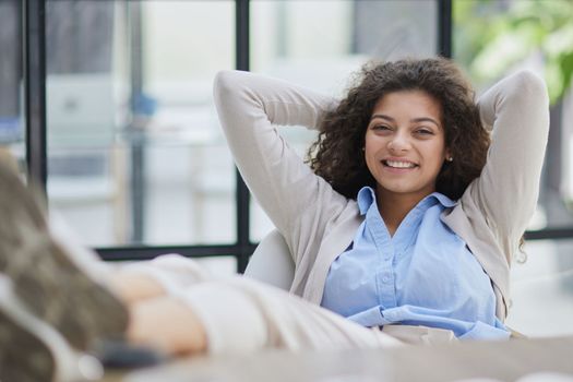 Tired businesswoman sleeping with closed eyes at workplace in office