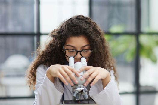 Female scientist researcher conducting an experiment in a labora