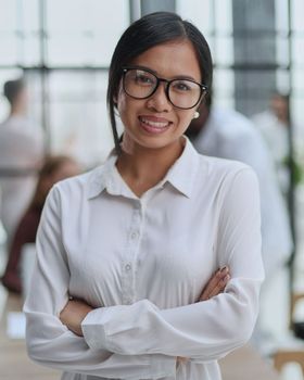 Young beautiful Asian business woman consultant working in the office,