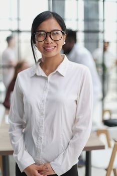 Young beautiful Asian business woman consultant working in the office,
