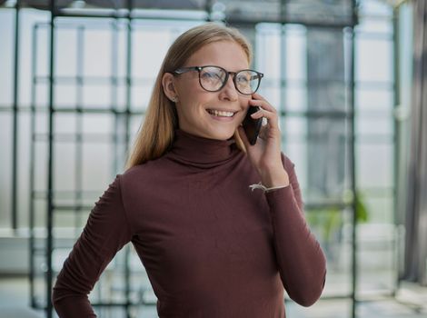Closeup portrait of attractive business woman smiling at camera