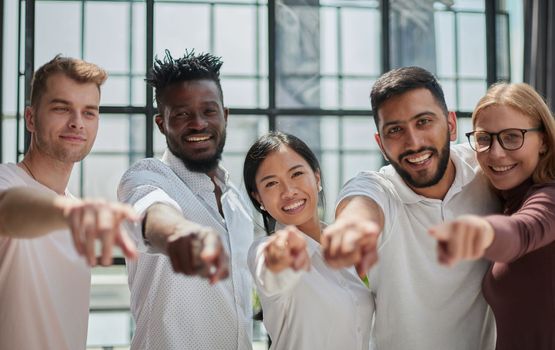 Strong and creative team. Group of business people and smiling at camera