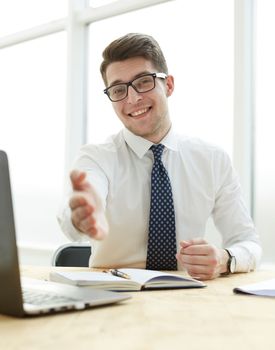 Smiling businessman pleased to meet you at office